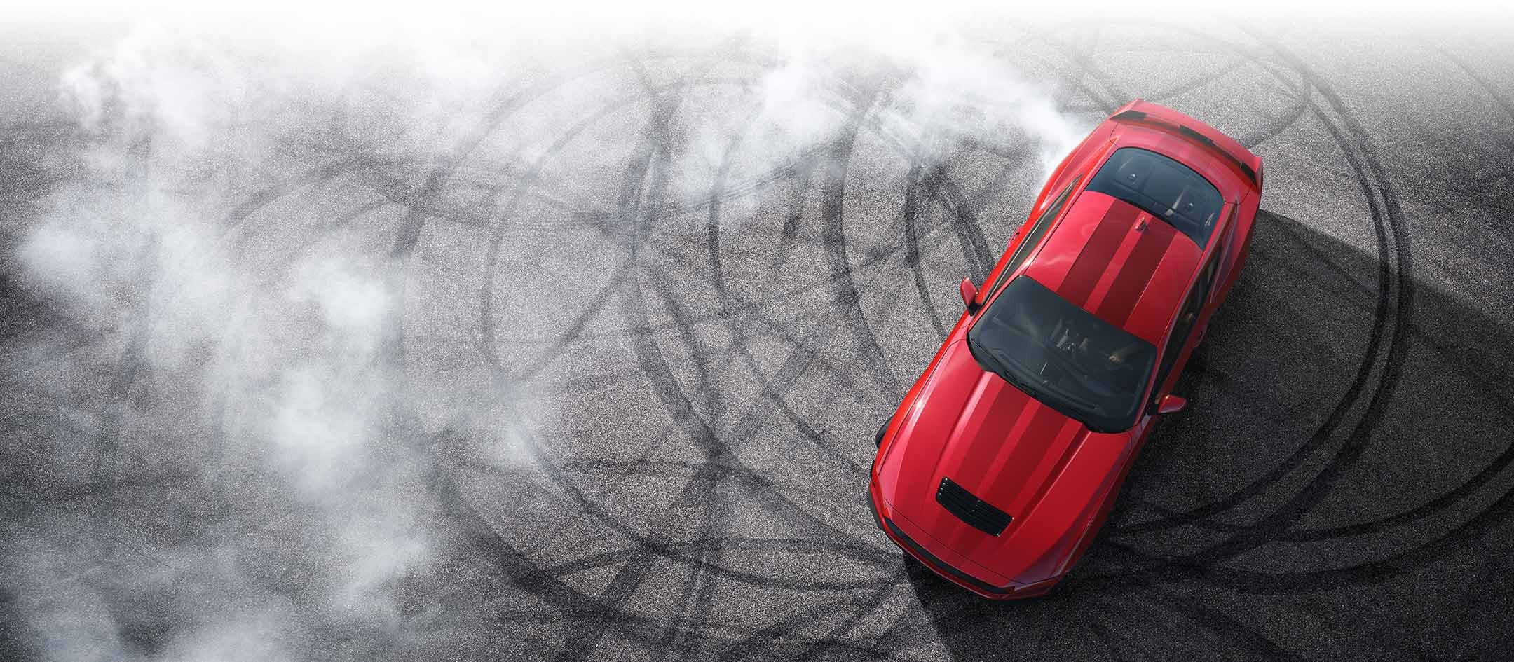Overhead view of a 2024 Ford Mustang® model with tire tracks on pavement | Sentry Ford in Medford MA