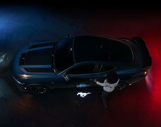 2024 Ford Mustang® Dark Horse™ model with a driver approaching the vehicle | Sentry Ford in Medford MA