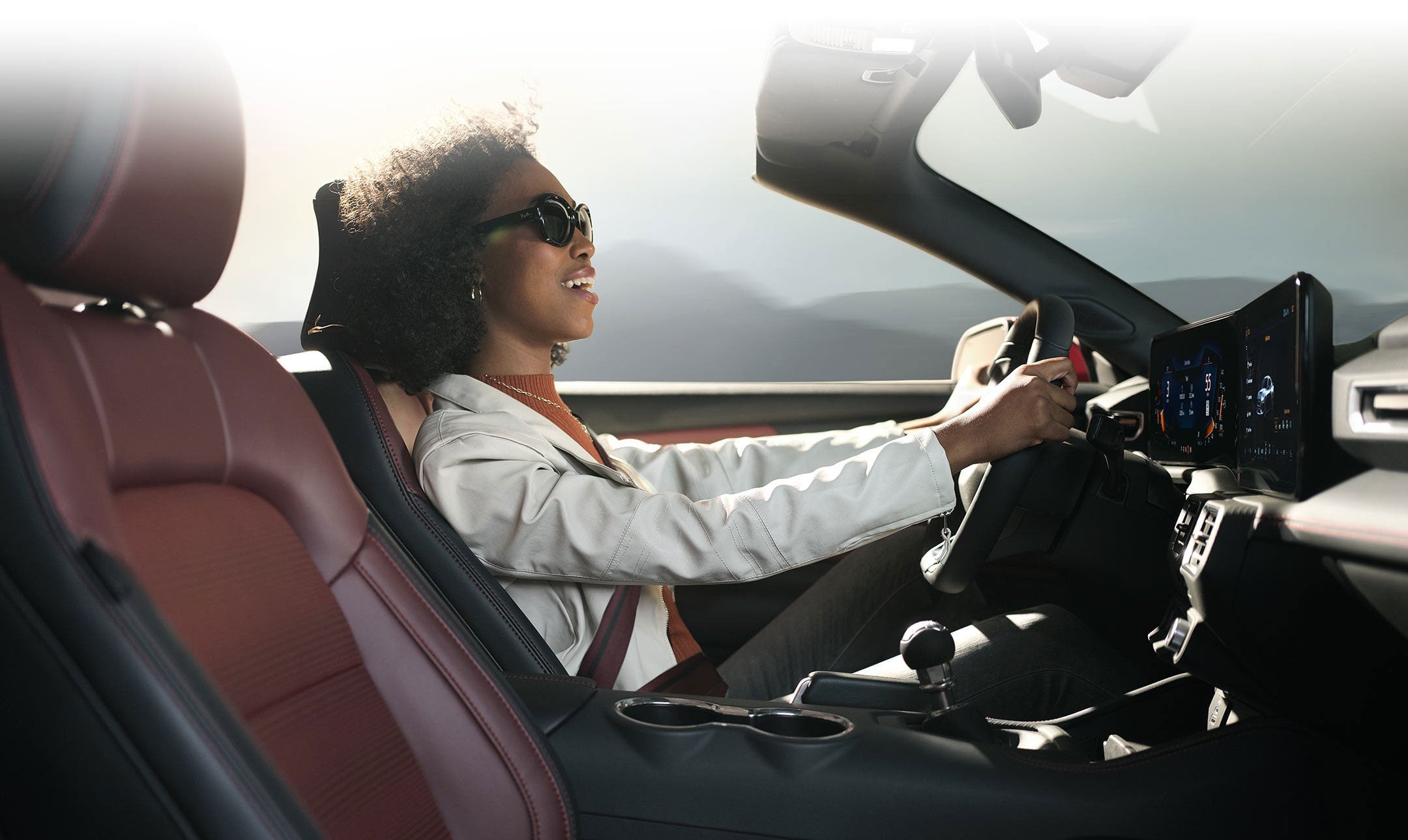 Person sitting in the driver’s seat of a 2024 Ford Mustang® convertible | Sentry Ford in Medford MA