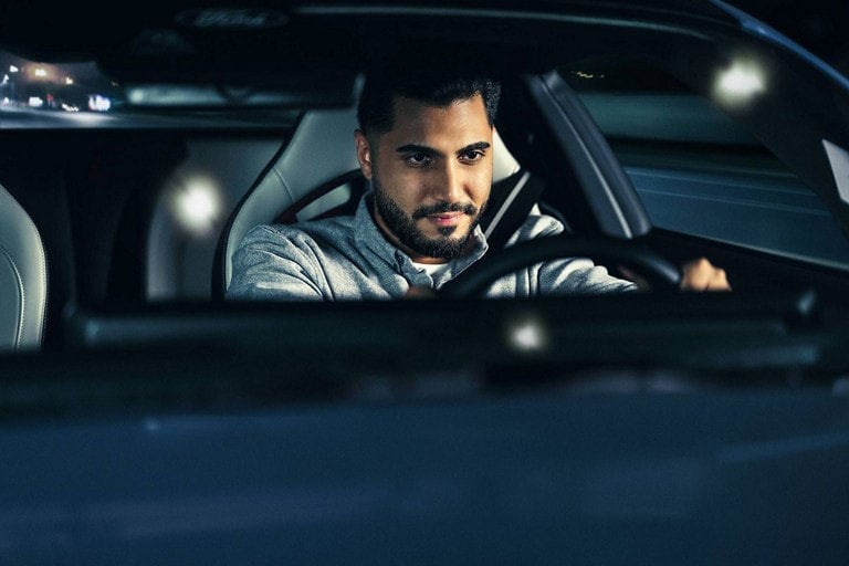 Person sitting in the driver’s seat of a parked 2024 Ford Mustang® coupe | Sentry Ford in Medford MA