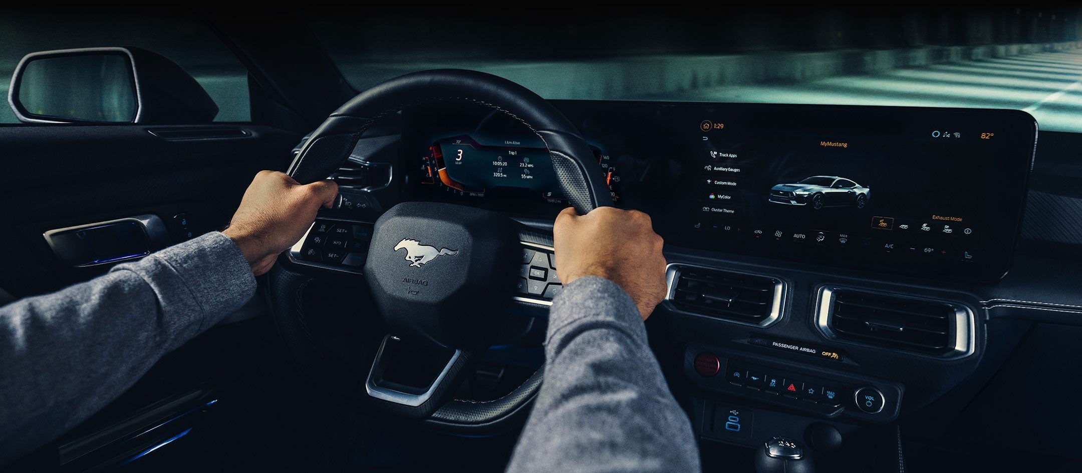 A 2024 Ford Mustang® model interior with a person driving | Sentry Ford in Medford MA
